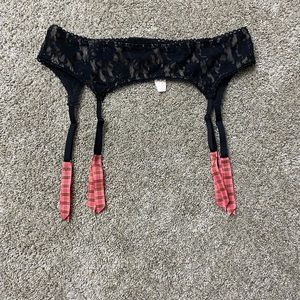 Victoria’s Secret black lace garter with pink ribbons